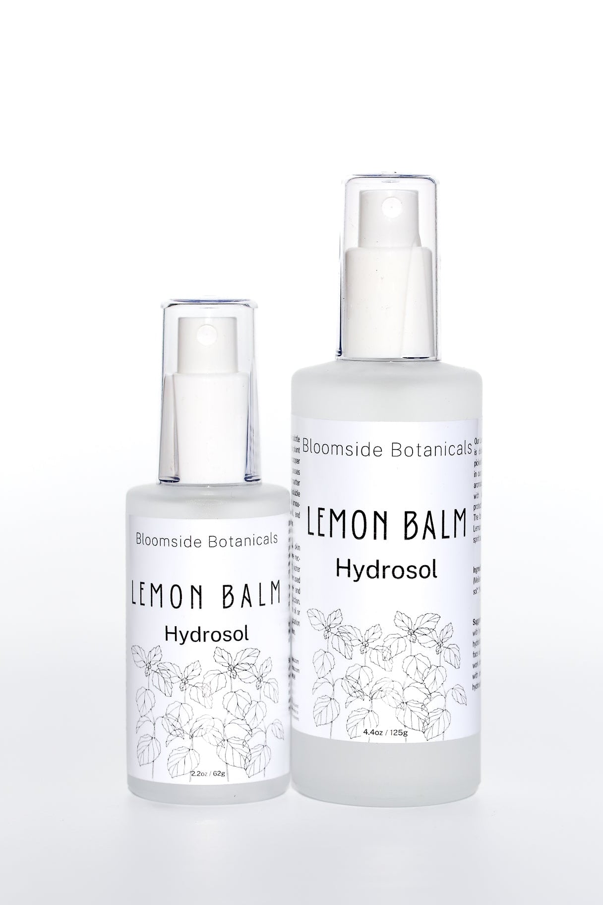 Two bottles of Lemon Balm Hydrosol from Bloomside Botanicals on a white background